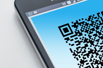 Photo of a QR code on a mobile phone screen